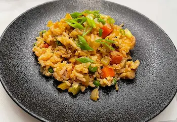 fried rice on a black plate